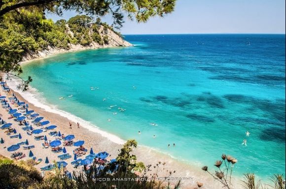 Lemonakia Beach with secluded cove, crystal-clear waters and natural pebble shoreline