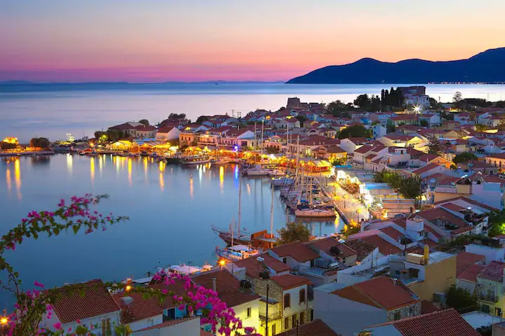 Pithagorio harbor with traditional Greek architecture and ancient fortifications