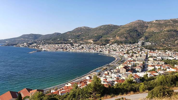 Vathi harbor with neoclassical buildings and ferry port