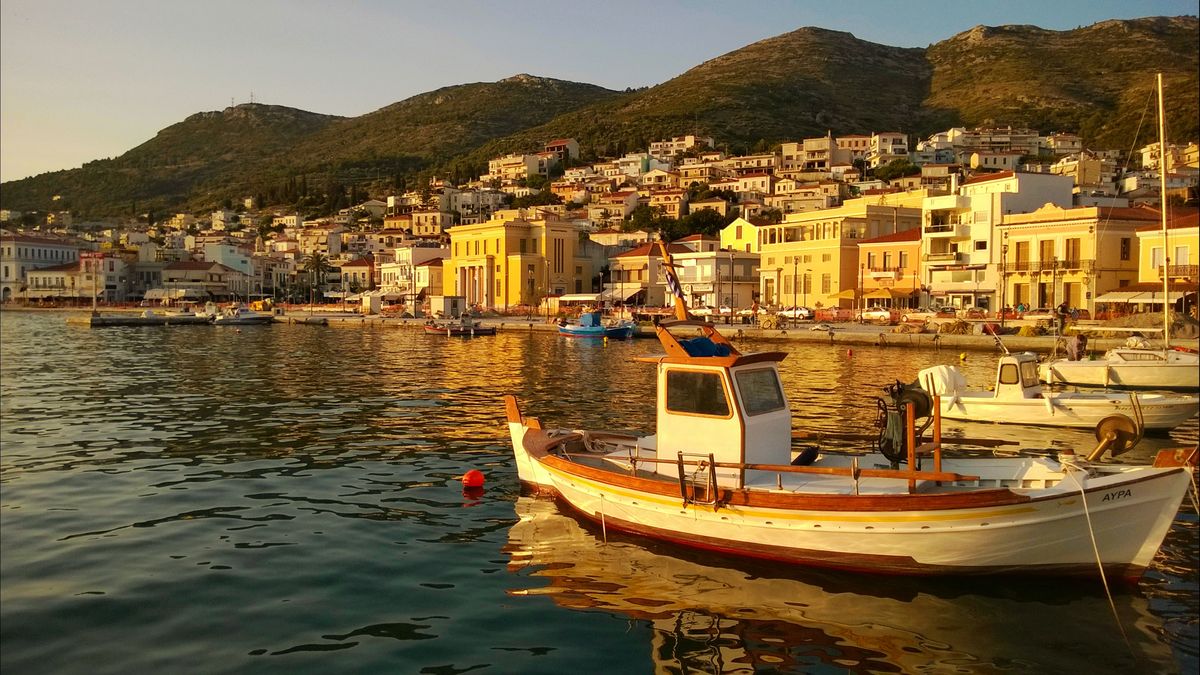 Vathi harbor with neoclassical buildings and ferry port